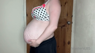 362577753_my-bump-is-growing-really-fast-watch-me-try-and-fit-in-a-ra_0.mp4