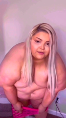24687827_squeezing-into-tight-nylon-pink-dress_0.mp4